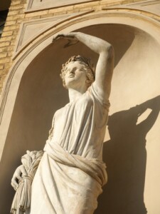 Stone statue in a wall niche at the Orangery Palace in Potsdam's Sanssouci Park.